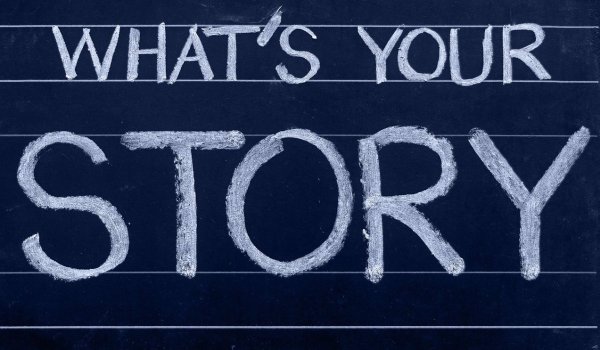 Blackboard with the text “What’s Your Story?” written in chalk.